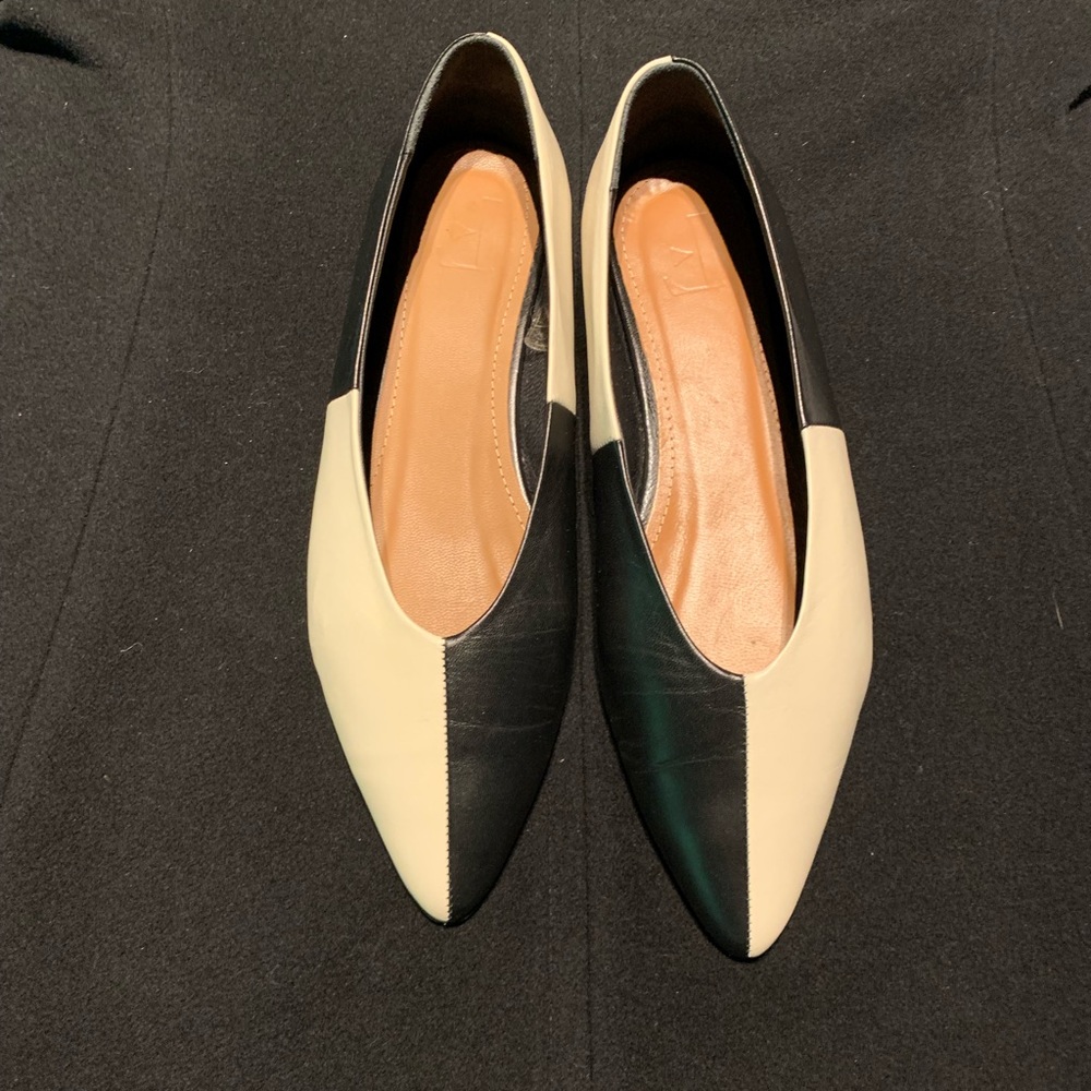 Black and beige leather ballerina style of shoes
